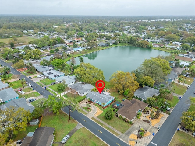 birds eye view of property with a residential view and a water view