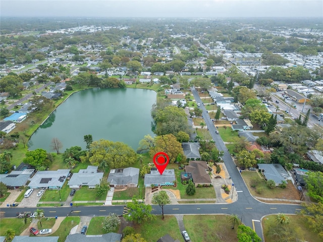 birds eye view of property with a residential view and a water view