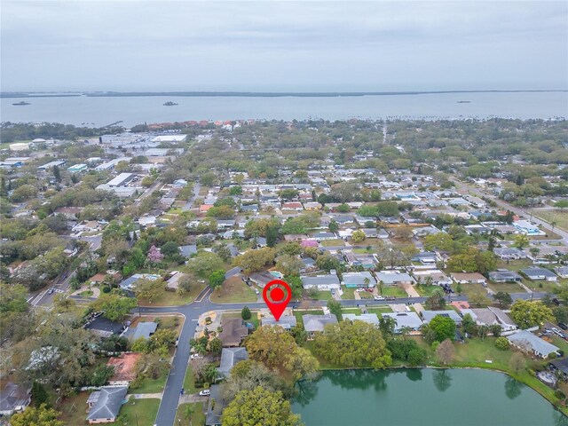 bird's eye view featuring a residential view and a water view