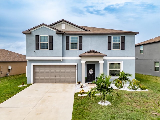 traditional home with a front yard and stucco siding