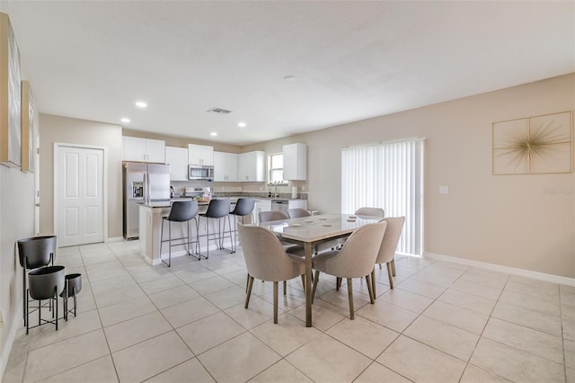 dining area featuring recessed lighting, visible vents, baseboards, and light tile patterned floors