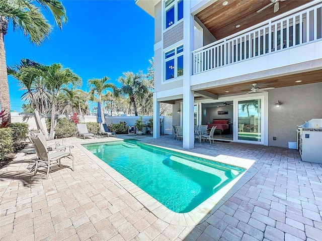 view of pool with a fenced in pool, a patio area, ceiling fan, and fence