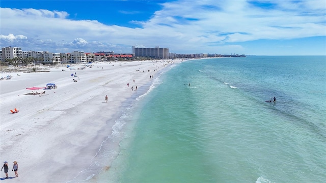 birds eye view of property with a water view, a view of city, and a view of the beach