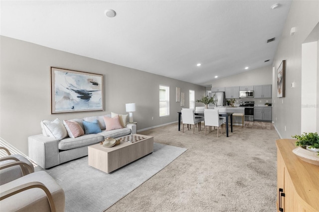 living room featuring light carpet, baseboards, visible vents, lofted ceiling, and recessed lighting