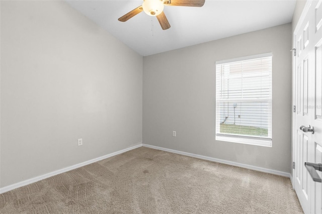 unfurnished room featuring carpet floors, ceiling fan, and baseboards