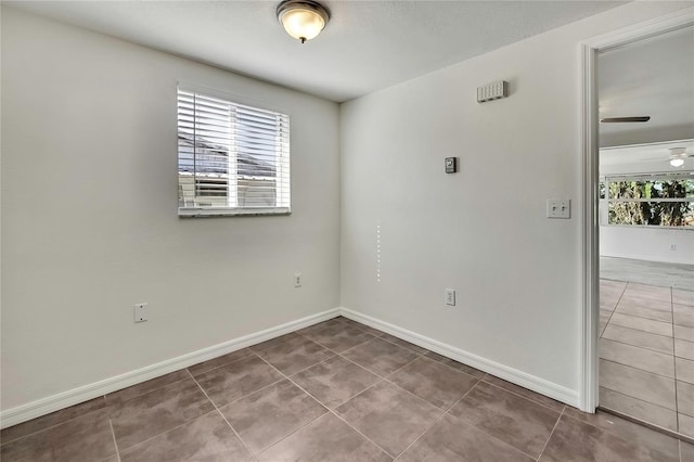 tiled empty room with baseboards