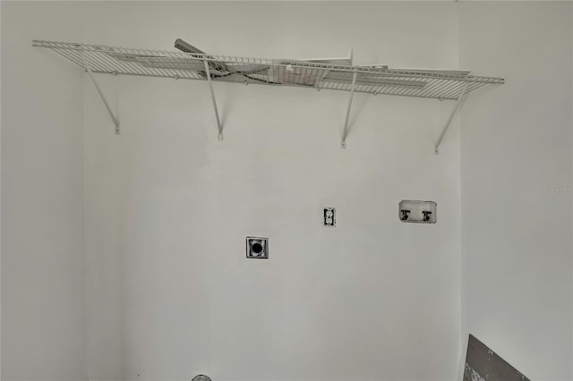 clothes washing area with washer hookup, laundry area, and hookup for an electric dryer