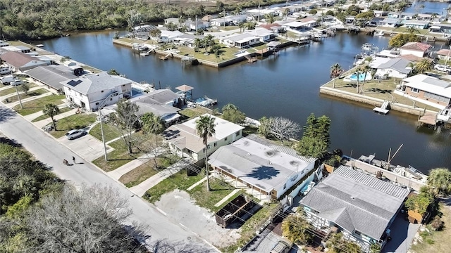 birds eye view of property with a residential view and a water view