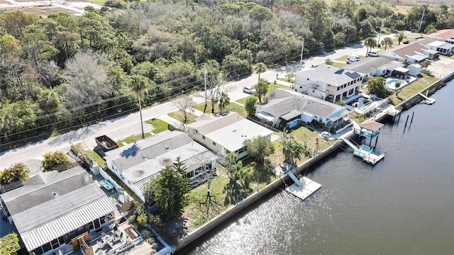 birds eye view of property with a water view and a residential view