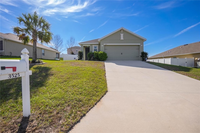 view of front of property with driveway, a garage, fence, and a front yard