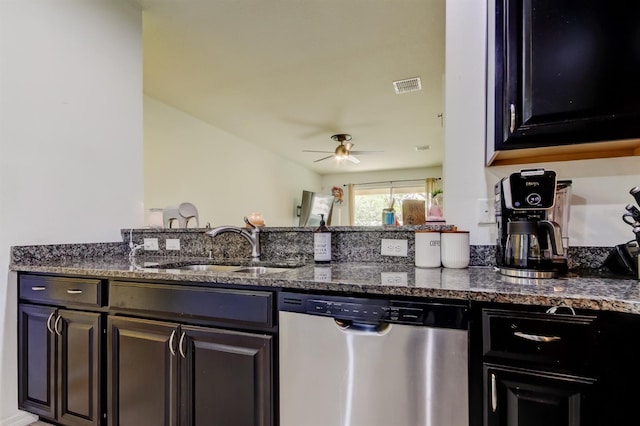 kitchen with visible vents, a ceiling fan, a sink, dark stone countertops, and dishwasher