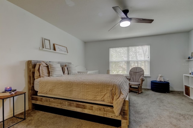 bedroom with carpet, a ceiling fan, and baseboards