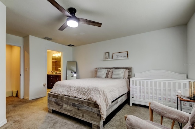 carpeted bedroom with baseboards, visible vents, and ceiling fan