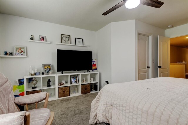 carpeted bedroom featuring a ceiling fan