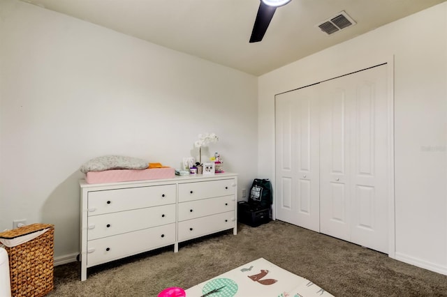 carpeted bedroom featuring baseboards, ceiling fan, visible vents, and a closet