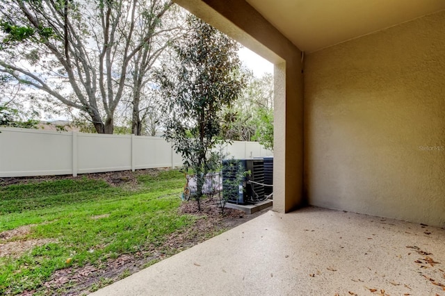 view of yard with cooling unit, a patio area, and a fenced backyard