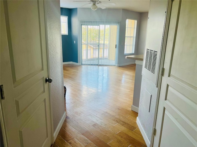 interior space with light wood-style flooring and baseboards