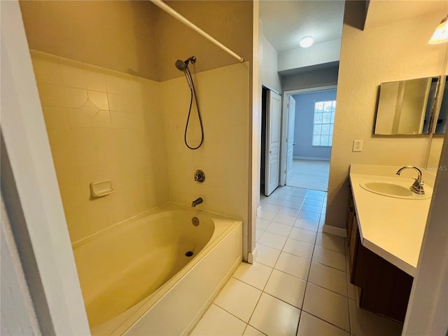 full bath with shower / bath combination, tile patterned floors, baseboards, and vanity