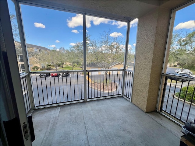 unfurnished sunroom featuring a wealth of natural light