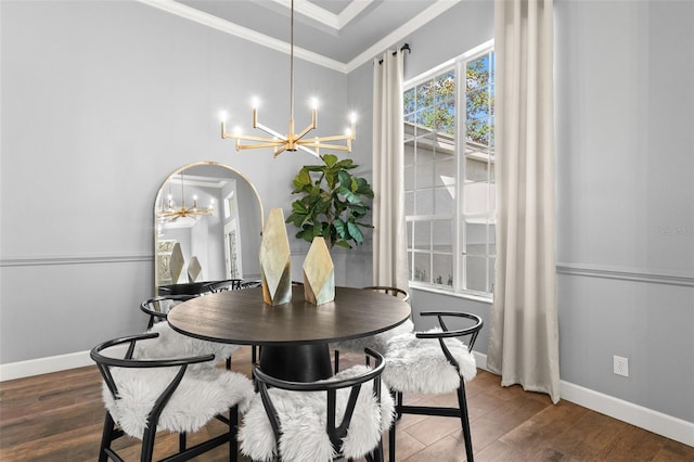 dining area with arched walkways, a notable chandelier, wood finished floors, baseboards, and crown molding