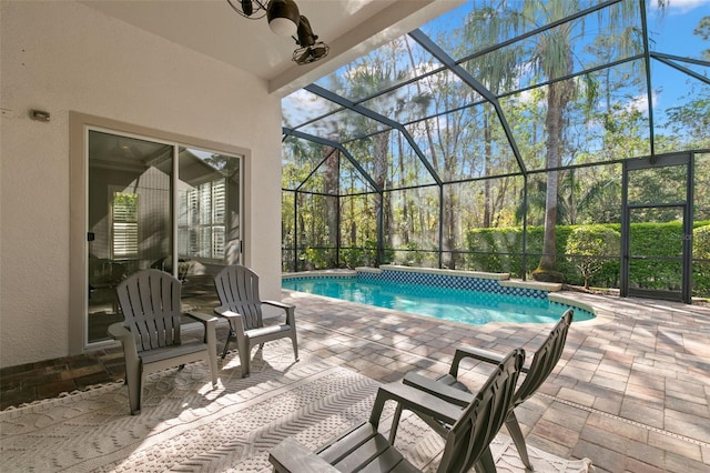 pool featuring a lanai and a patio area