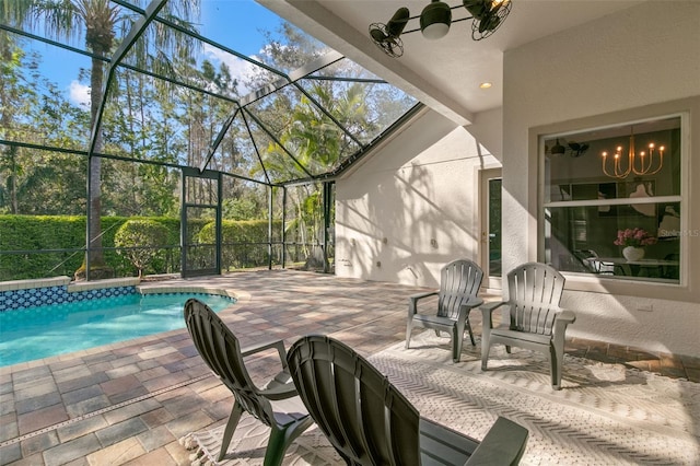 view of patio / terrace with glass enclosure and an outdoor pool