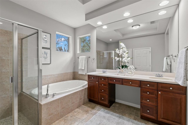 full bath featuring a garden tub, double vanity, a sink, a shower stall, and tile patterned flooring