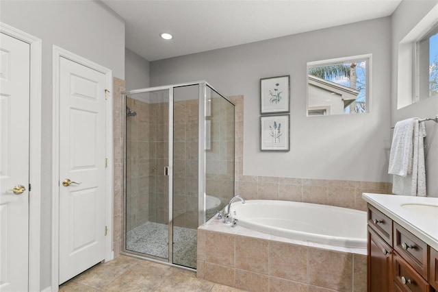 full bath with a stall shower, tile patterned floors, vanity, a bath, and recessed lighting