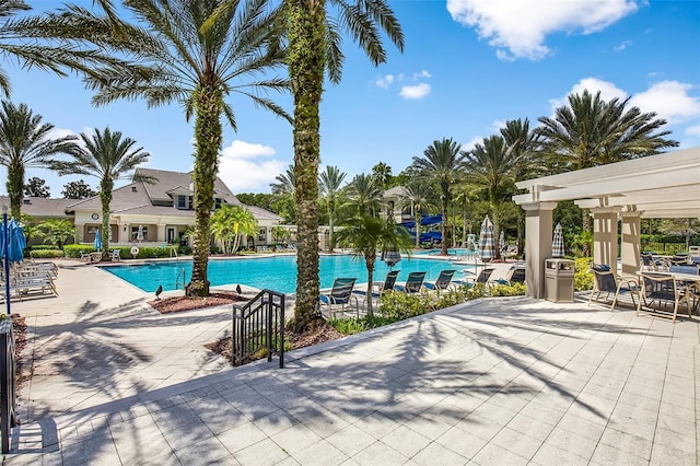 pool featuring a patio area and a pergola