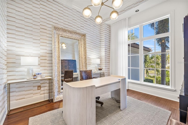 office with hardwood / wood-style flooring, baseboards, and a notable chandelier