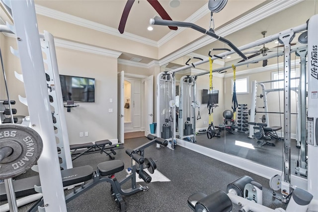 gym with ornamental molding, baseboards, and a ceiling fan