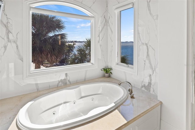 bathroom with a whirlpool tub