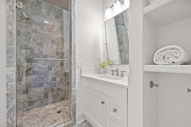 full bathroom with a shower stall and vanity