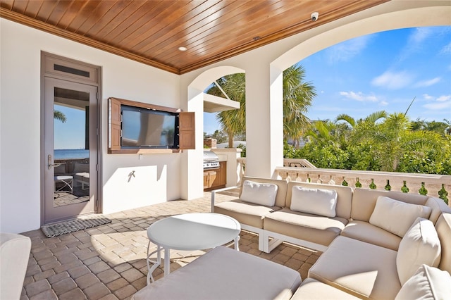 view of patio with exterior kitchen, area for grilling, and an outdoor hangout area