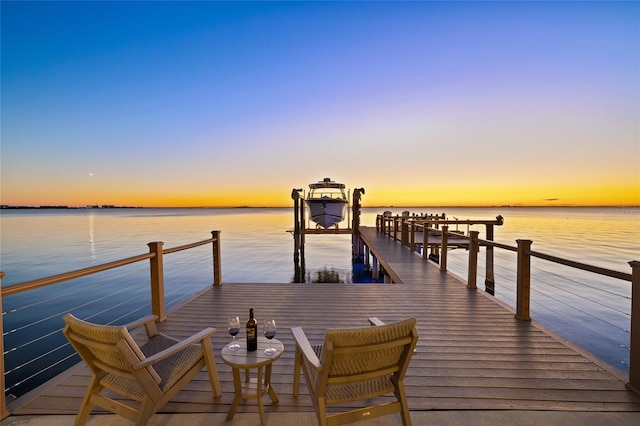 view of dock with a water view and boat lift