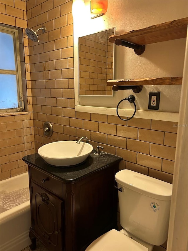 bathroom featuring backsplash, a textured wall, tile walls, and toilet