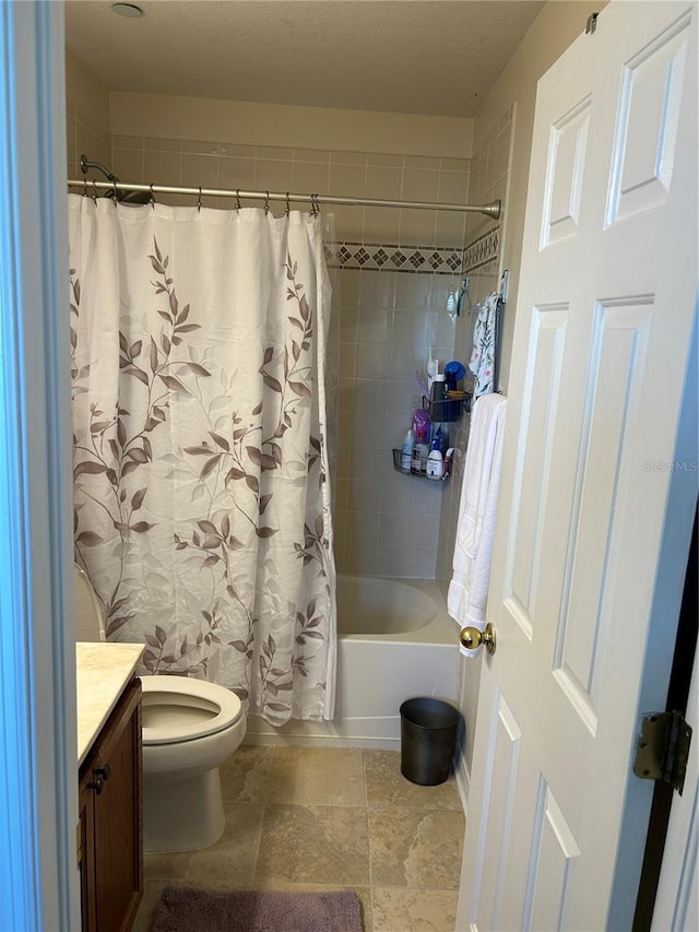 bathroom with toilet, vanity, and shower / tub combo with curtain