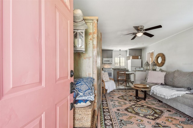 living room featuring a ceiling fan