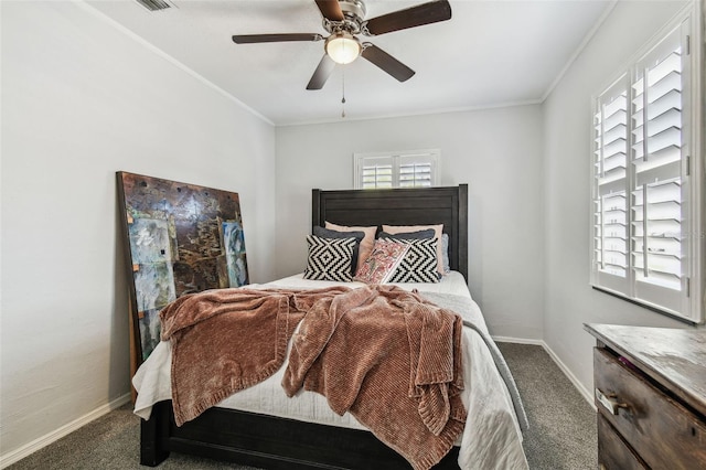 carpeted bedroom with ornamental molding, ceiling fan, and baseboards