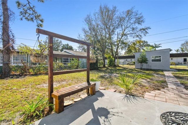 view of patio / terrace featuring fence