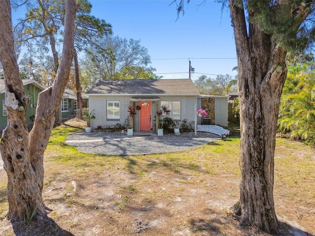 ranch-style home with stucco siding