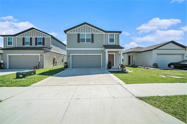 view of front of home featuring board and batten siding, a front lawn, driveway, and an attached garage