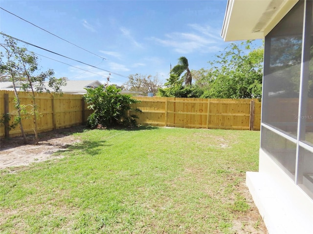 view of yard with a fenced backyard