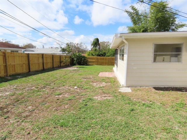 view of yard with a fenced backyard