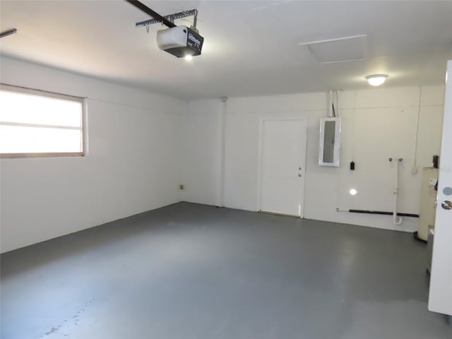 garage with water heater, electric panel, and a garage door opener