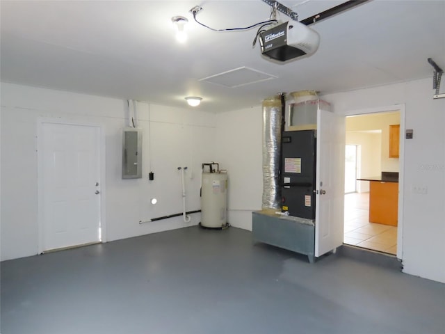 garage featuring electric panel, water heater, and a garage door opener