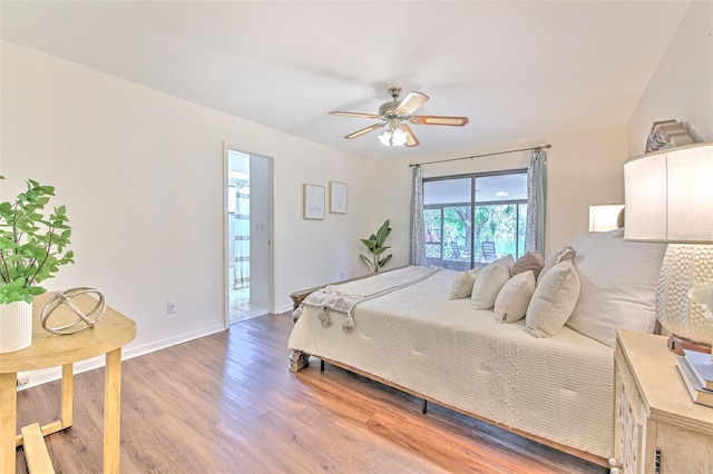 bedroom featuring light wood-type flooring, a ceiling fan, and baseboards