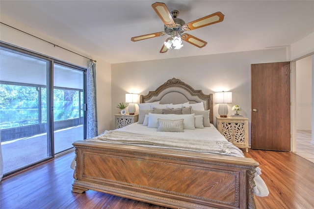 bedroom featuring a ceiling fan, access to outside, and wood finished floors