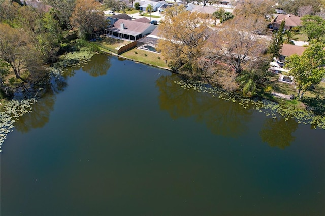 birds eye view of property with a water view and a residential view