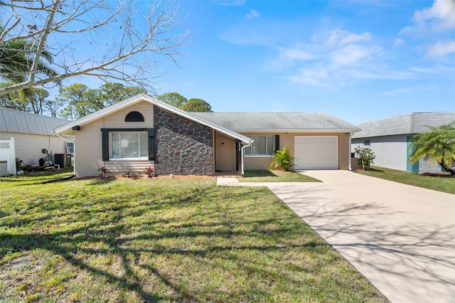 view of front facade featuring a front yard, stone siding, driveway, and an attached garage